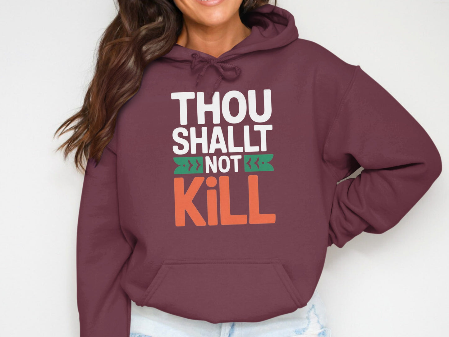 Maroon hoodie with "THOU SHALT NOT KILL" graphic print.