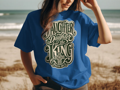 Blue t-shirt with "Daughter of the King" text and cross design.