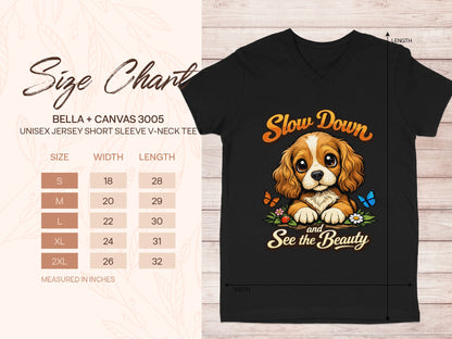 Black v-neck tee with "Slow Down and See the Beauty" text and dog graphic.