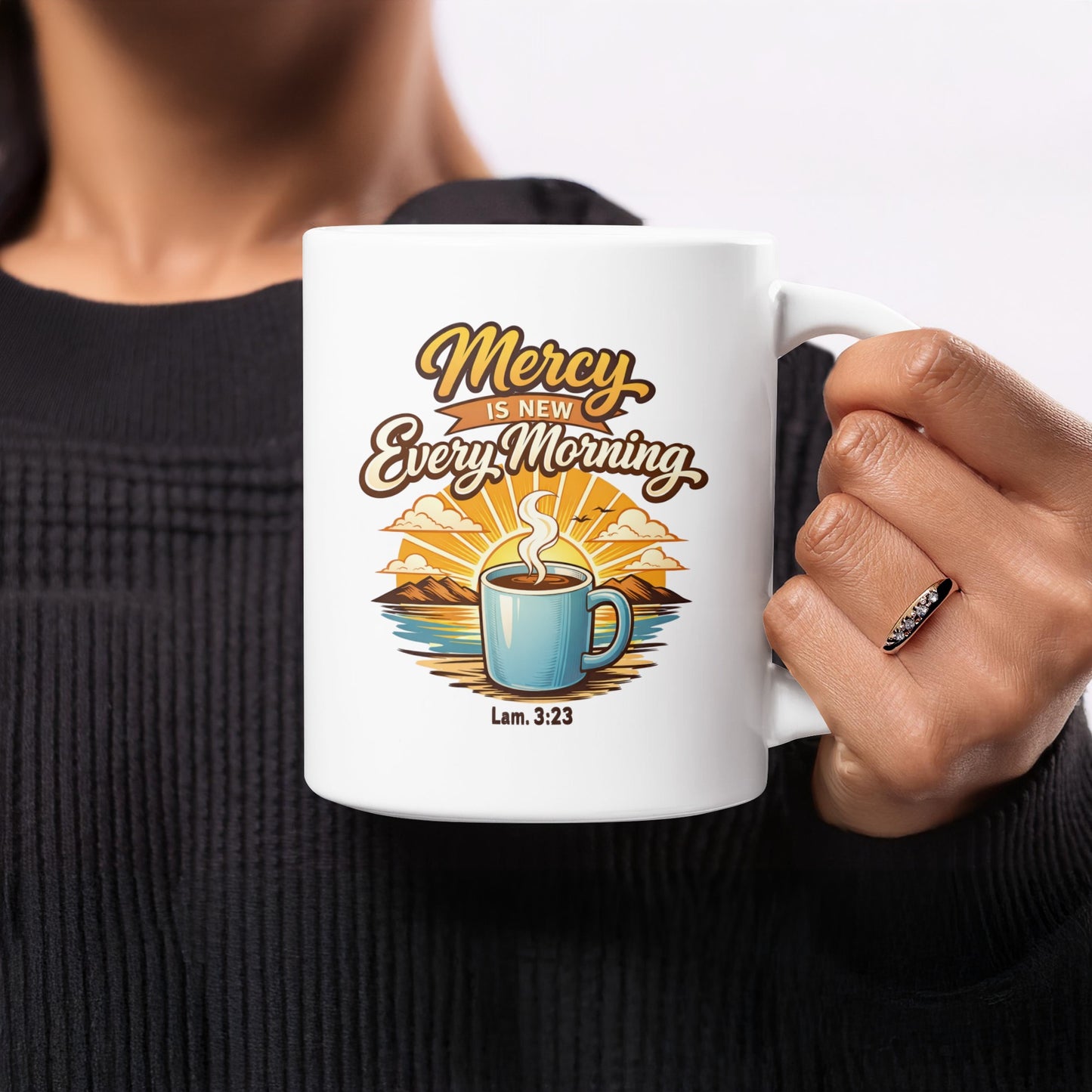 White mug with "Mercy Is New Every Morning" text and a coffee cup illustration.