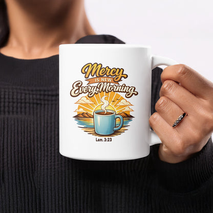 White mug with "Mercy Is New Every Morning" text and a coffee cup illustration.