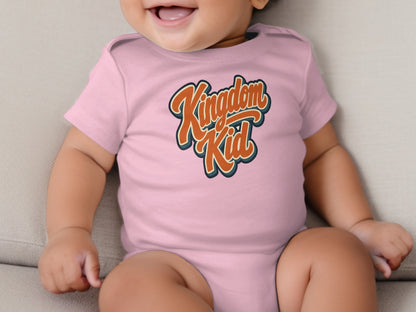 Pink baby bodysuit with "Kingdom Kid" text in orange and blue wavy font.