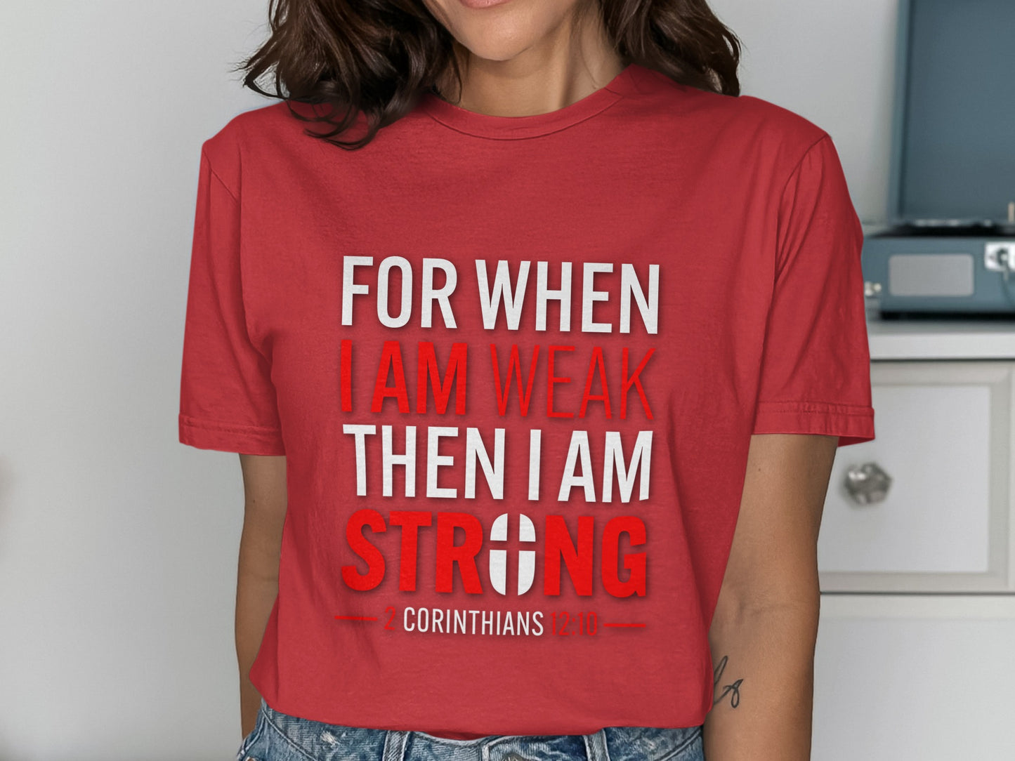 Red t-shirt with text "FOR WHEN I AM WEAK THEN I AM STRONG 2 CORINTHIANS 12:10".