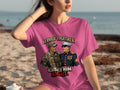 Pink t-shirt with illustration of two smiling soldiers and text "SERVED TOGETHER RAISED HIM RIGHT".