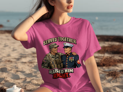 Pink t-shirt with illustration of two smiling soldiers and text "SERVED TOGETHER RAISED HIM RIGHT".