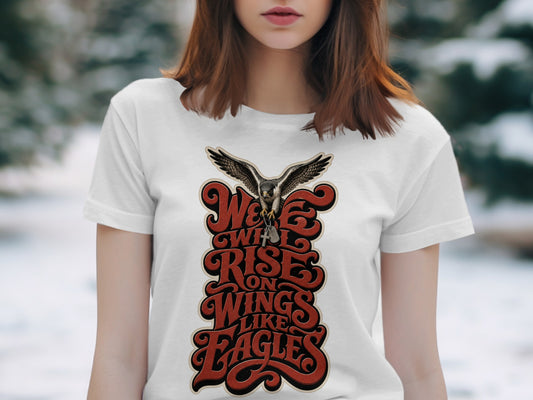 White t-shirt with a graphic of a hawk and text "We will rise on wings like eagles".