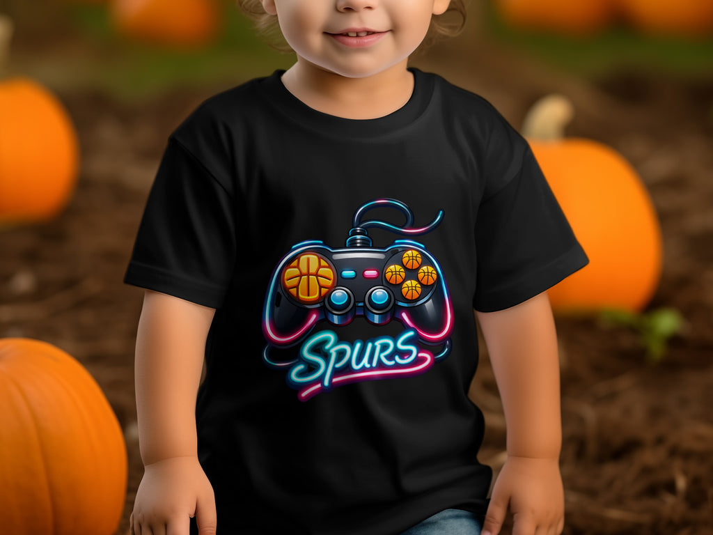 Black t-shirt with video game controller and "Spurs" text, child model.
