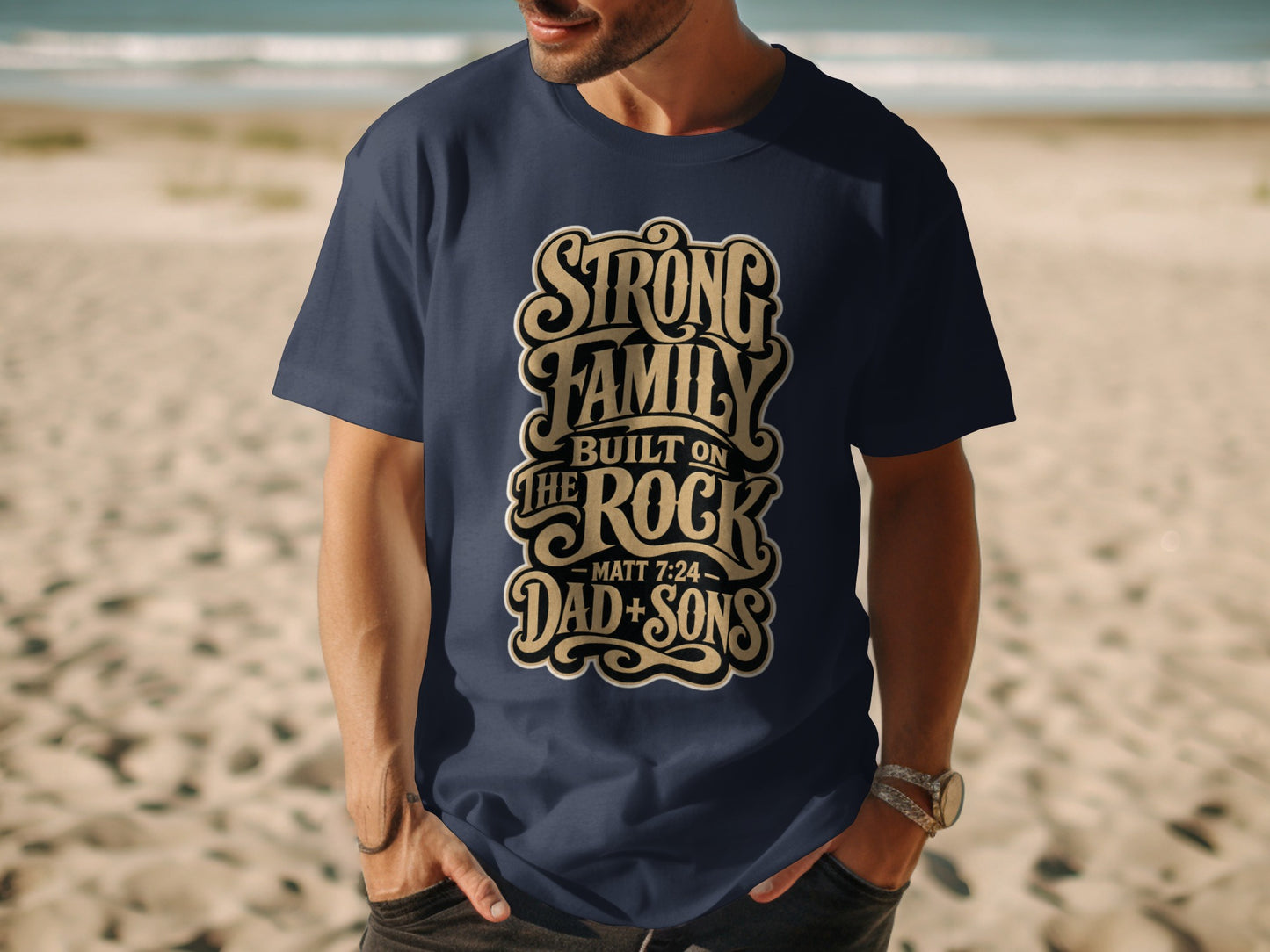 Dark blue t-shirt with "Strong Family Built On The Rock" text.