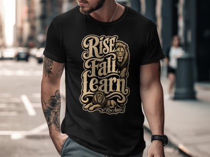 Black t-shirt with gold lettering "Rise Fall Learn" and lion graphics.
