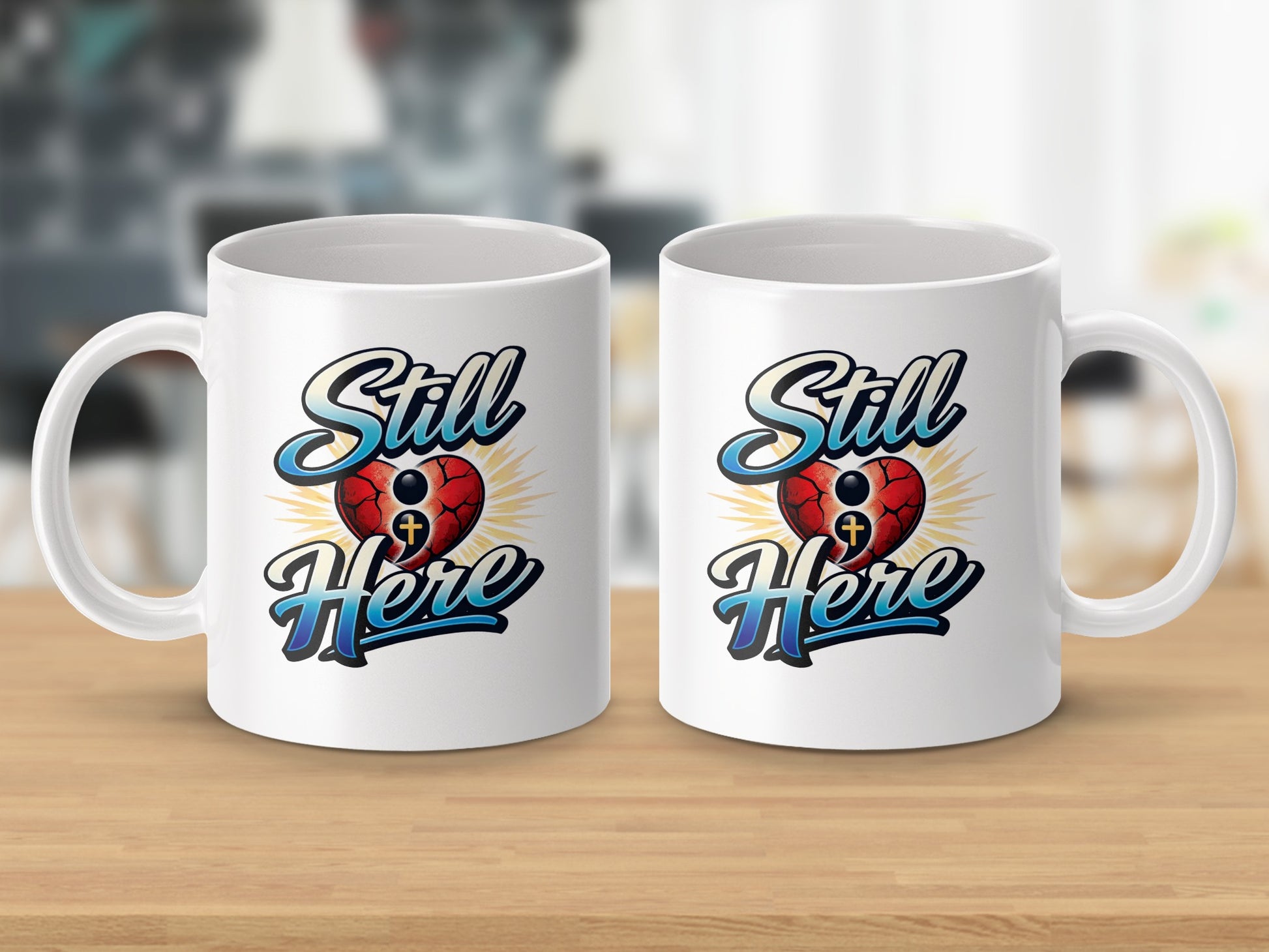Two white mugs featuring a red cracked heart with a cross and the text "Still Here".