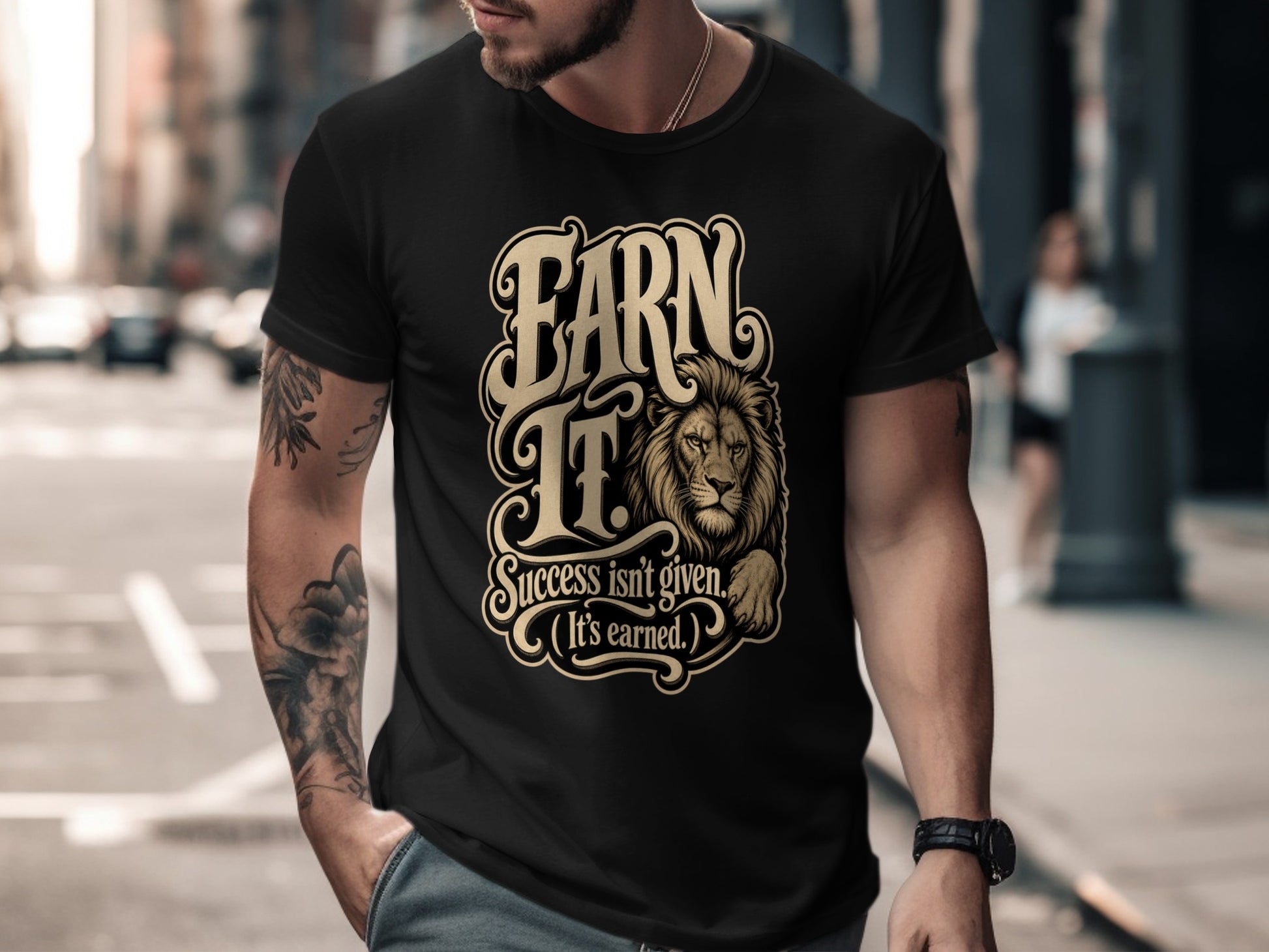 Black t-shirt with "Earn It. Success isn't given. (It's earned.)" and a lion graphic.