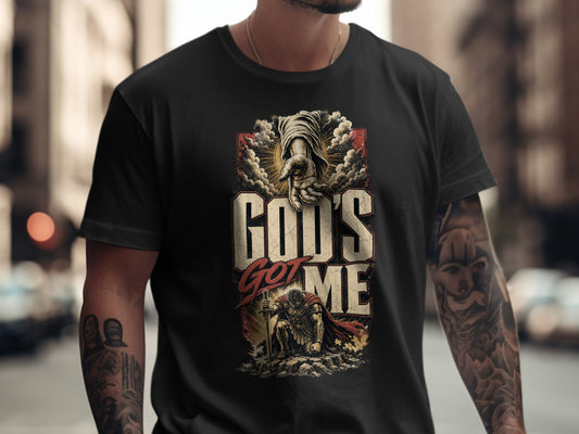 Black t-shirt with "God's Got Me" text and imagery of a hand and warrior.