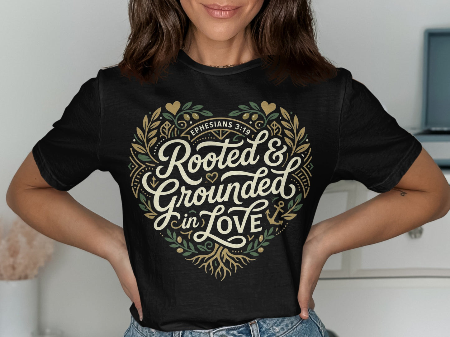 Black t-shirt with heart design, text "Rooted & Grounded in Love" and Ephesians 3:19.
