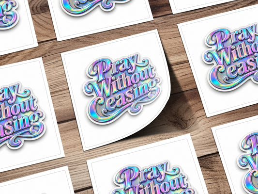 Holographic "Pray Without Ceasing" text on multiple white cards on a wooden background.
