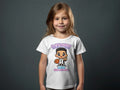 Child wearing white t-shirt with "Wemby ERA Next Generation" and cartoon basketball player graphic.