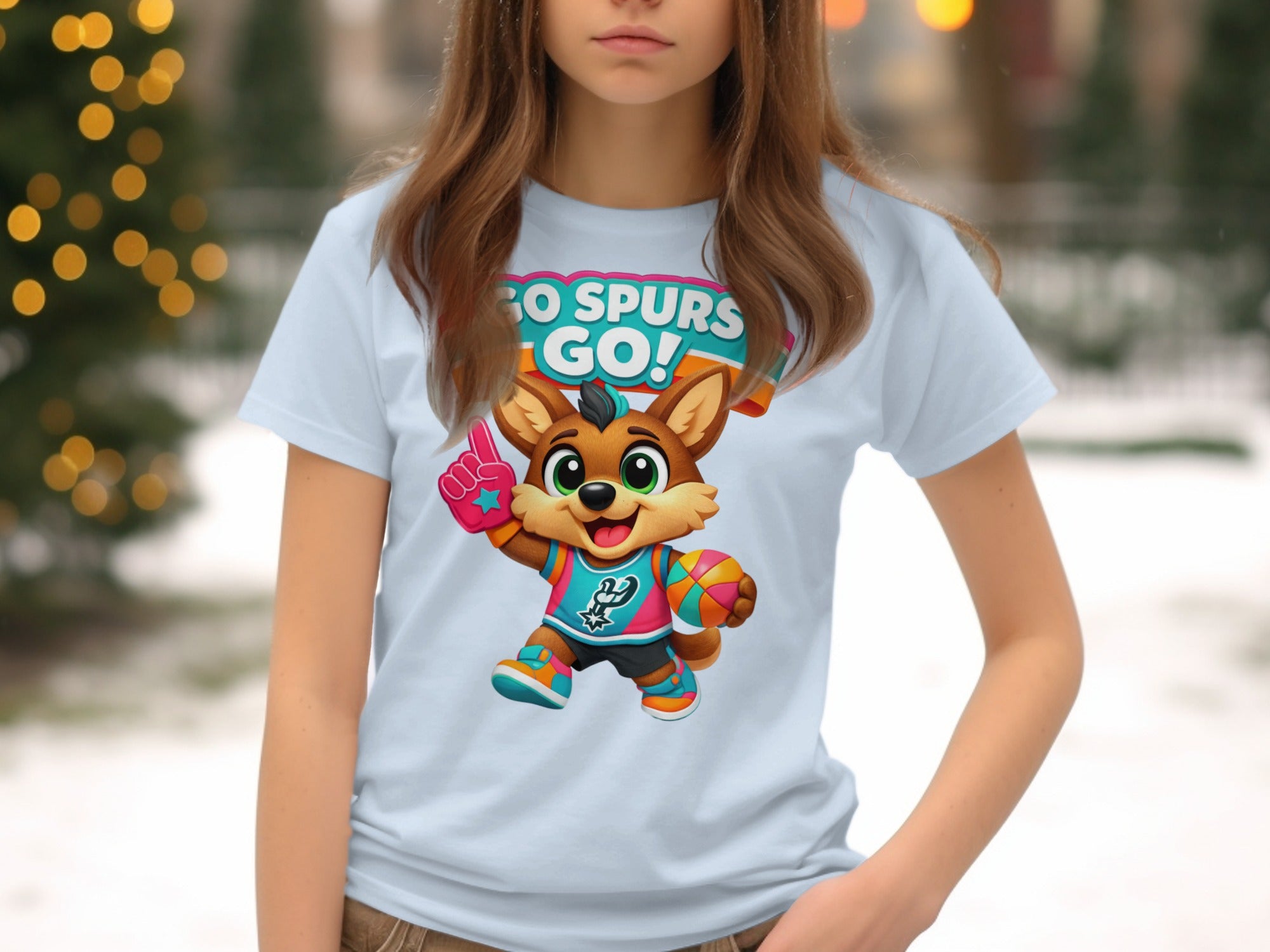 Cartoon fox mascot with "GO SPURS GO!" text on a light blue t-shirt.