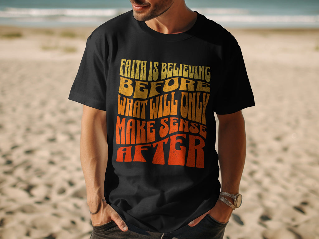Black t-shirt with wavy text: Faith is believing before what will only make sense after.