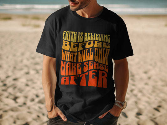 Black t-shirt with wavy text: Faith is believing before what will only make sense after.