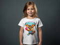 Child wearing white t-shirt with a cartoon fox character holding a basketball.