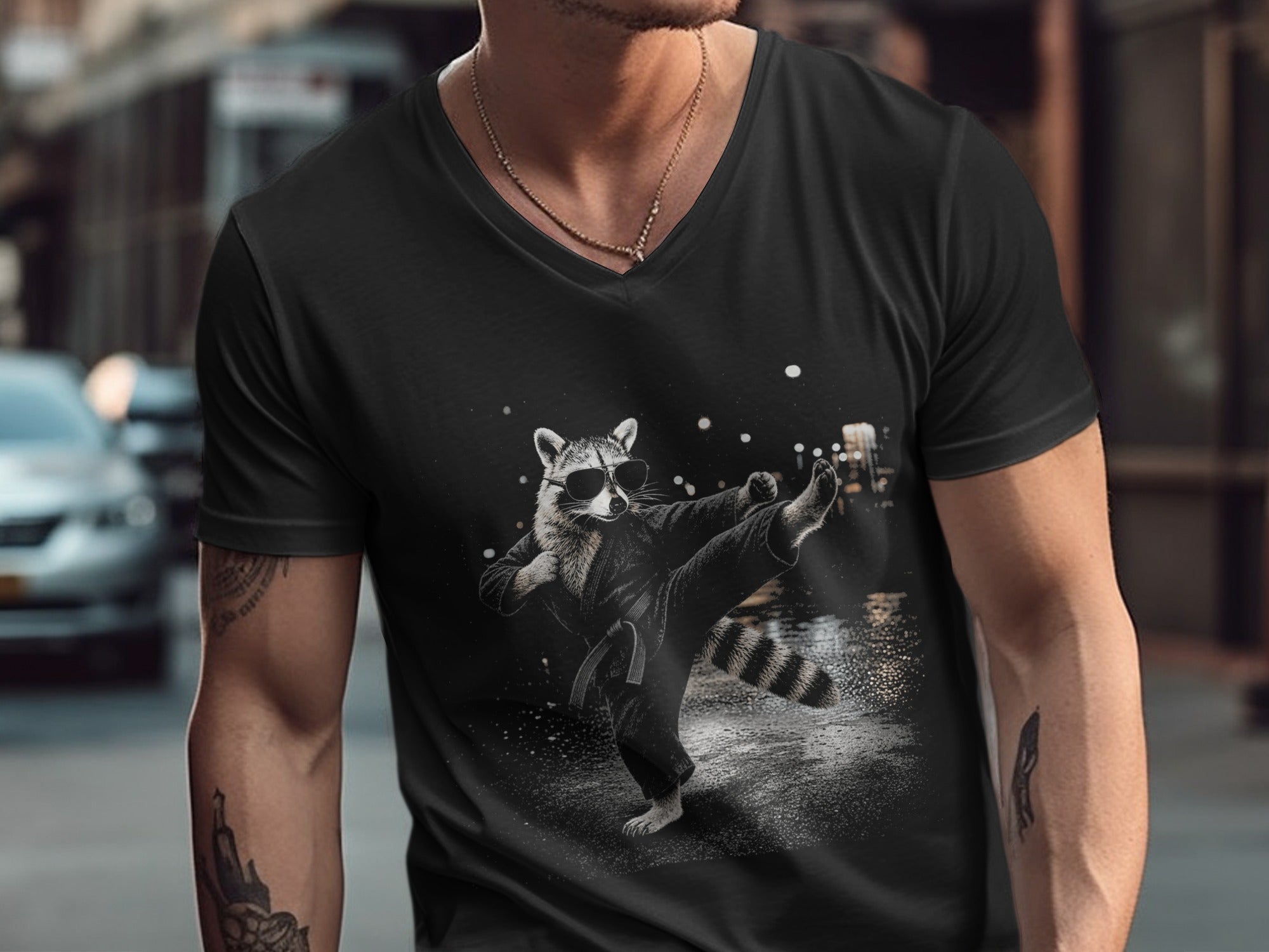 Black t-shirt with a graphic of a raccoon in a karate outfit performing a kick.