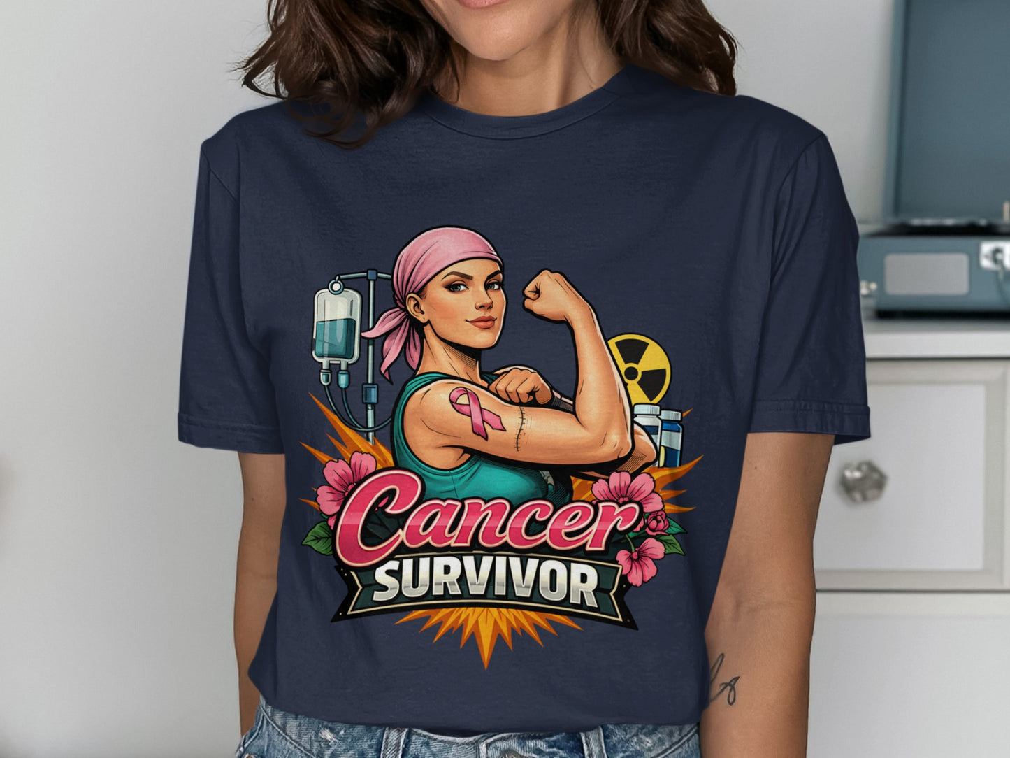 Cancer Survivor t-shirt graphic with woman flexing, IV bag, and pink ribbon.