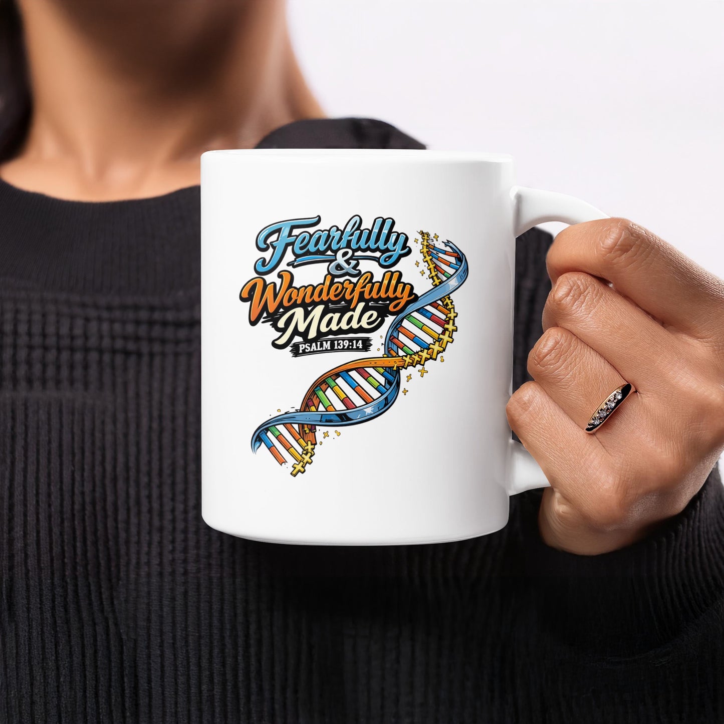 White mug with "Fearfully & Wonderfully Made Psalm 139:14" and a DNA strand.