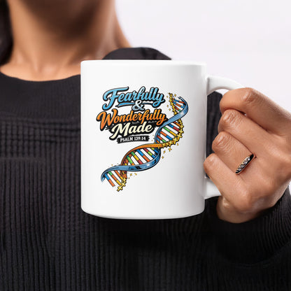 White mug with "Fearfully & Wonderfully Made Psalm 139:14" and a DNA strand.