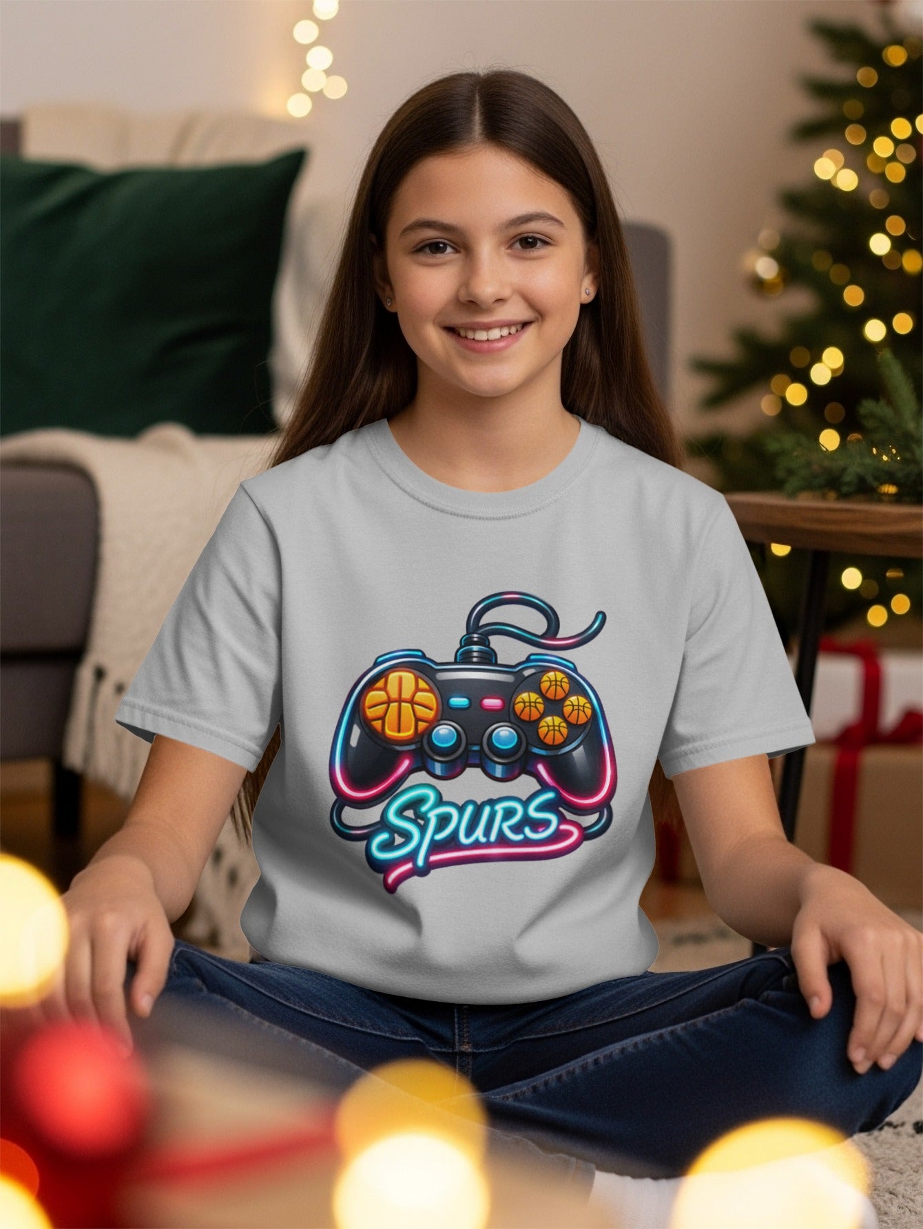 Gray t-shirt featuring a neon video game controller with basketballs and the word "Spurs".