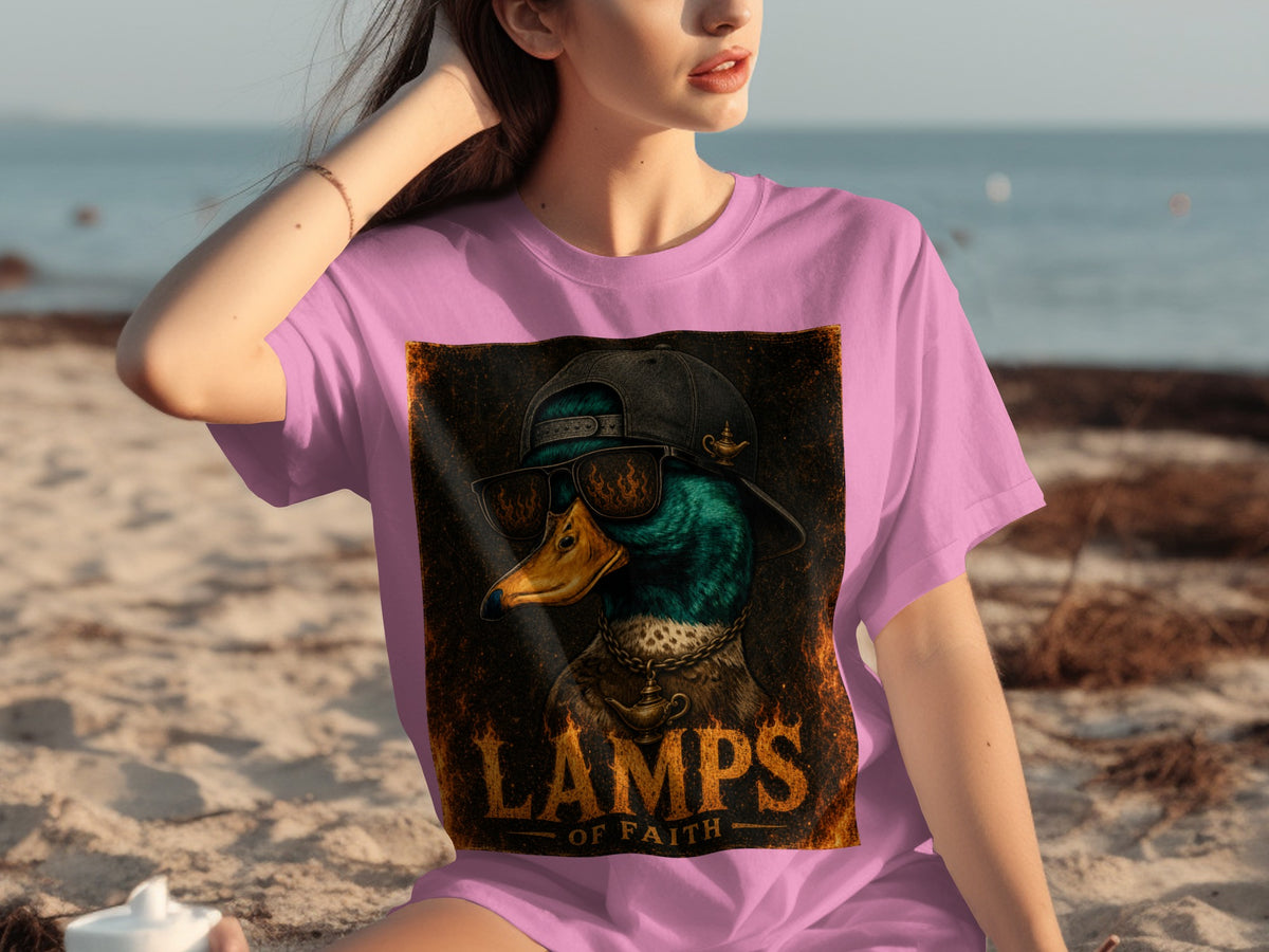 Pink t-shirt with a graphic of a duck wearing sunglasses and a hat, with "LAMPS OF FAITH" text.