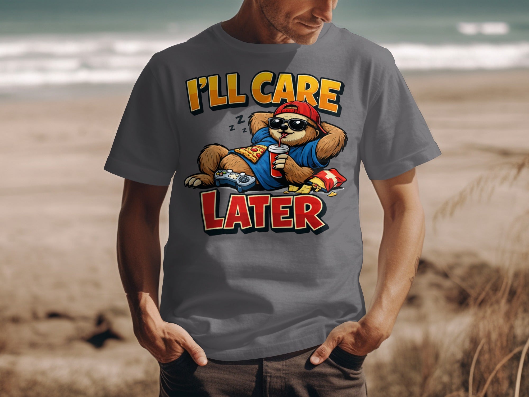 T-shirt graphic with sloth text "I'll Care Later" holding drink and controller.