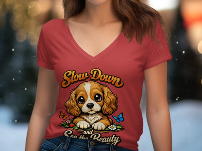 Red v-neck t-shirt with a cute puppy, butterflies, and text "Slow Down and See the Beauty".