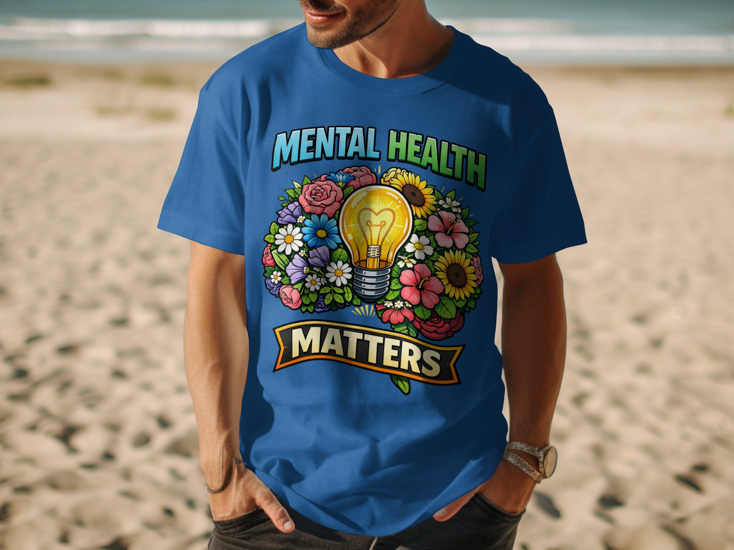 Blue t-shirt with 'Mental Health Matters' and a lightbulb surrounded by flowers.