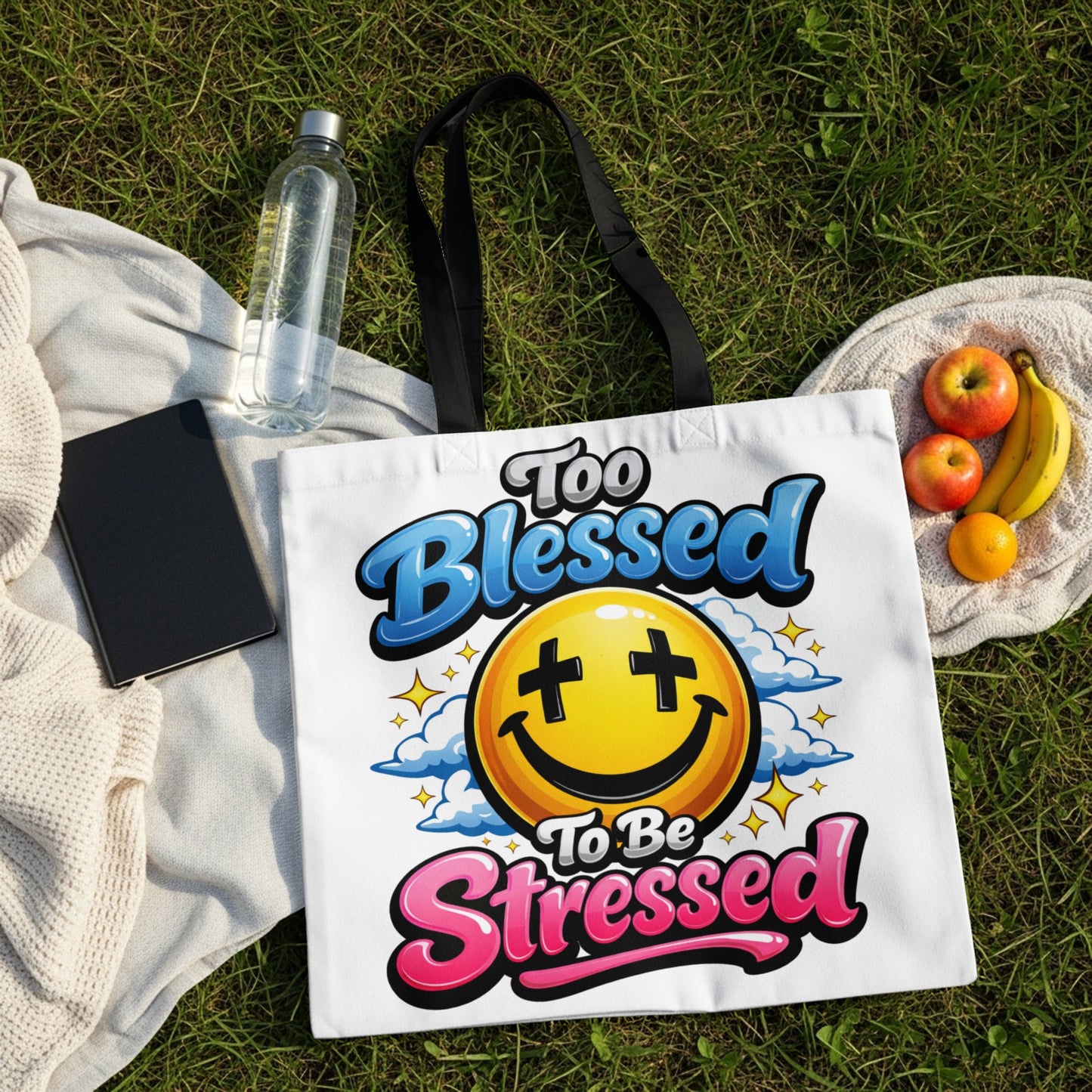 White tote bag with "Too Blessed To Be Stressed" text and smiley face graphic.