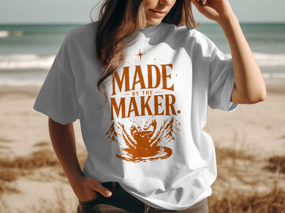 White t-shirt with "Made by the Maker" text and pottery hands graphic.