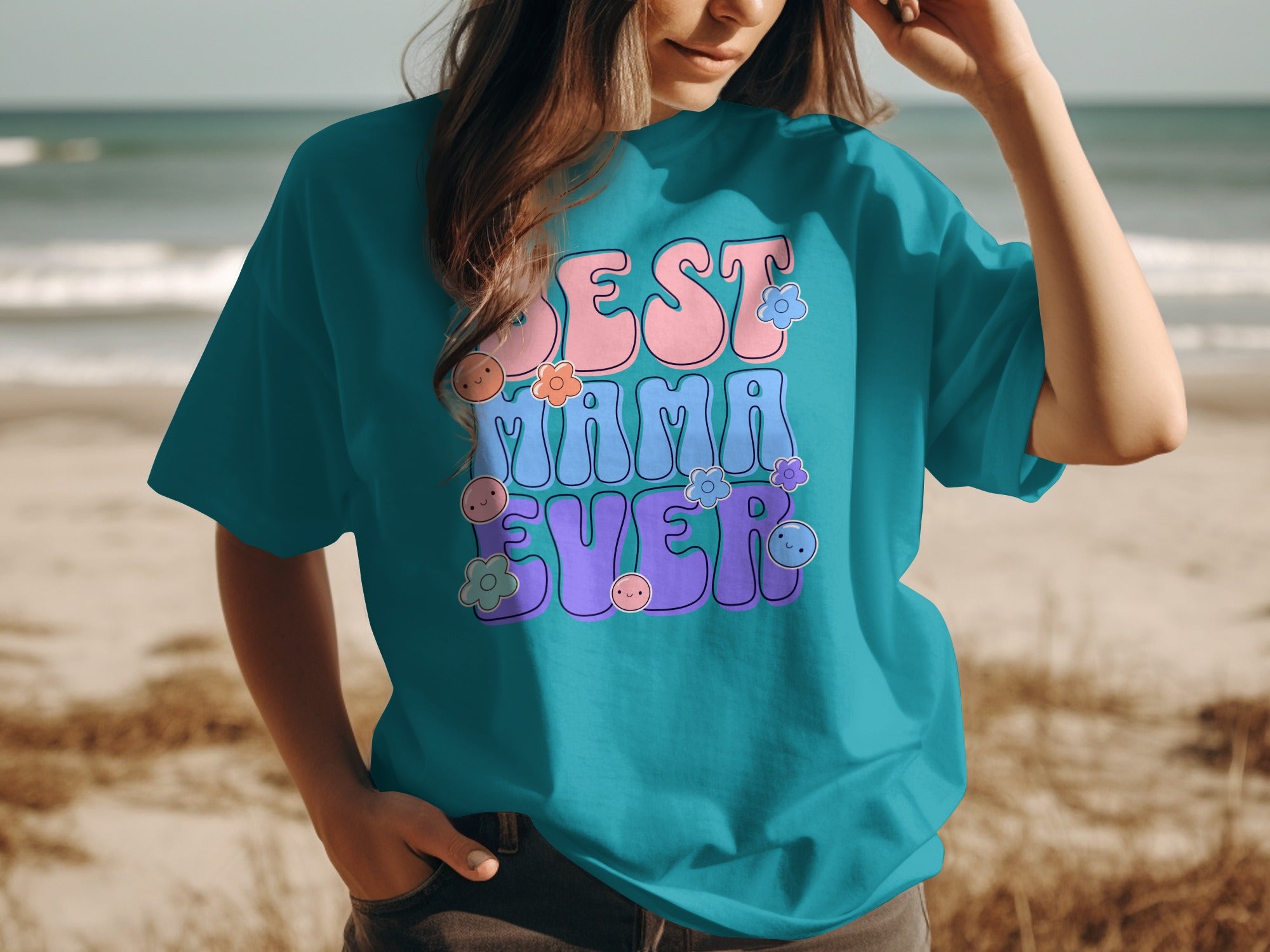 Turquoise t-shirt with "BEST MAMA EVER" text and flower accents.