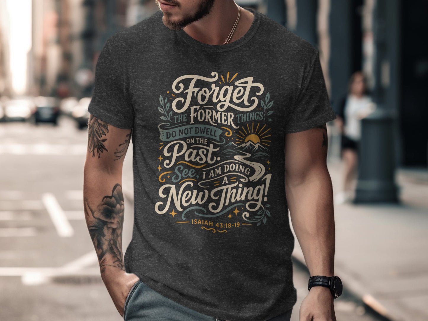 Dark grey t-shirt with "Forget the former things..." text and Isaiah 43:18-19.