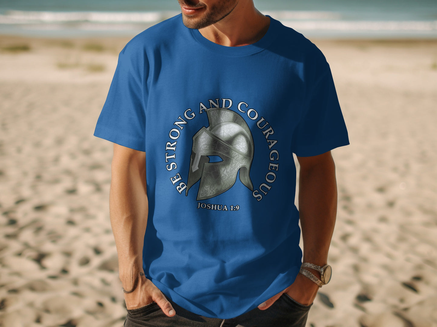 Blue t-shirt with silver helmet graphic and text "Be Strong and Courageous, Joshua 1:9".