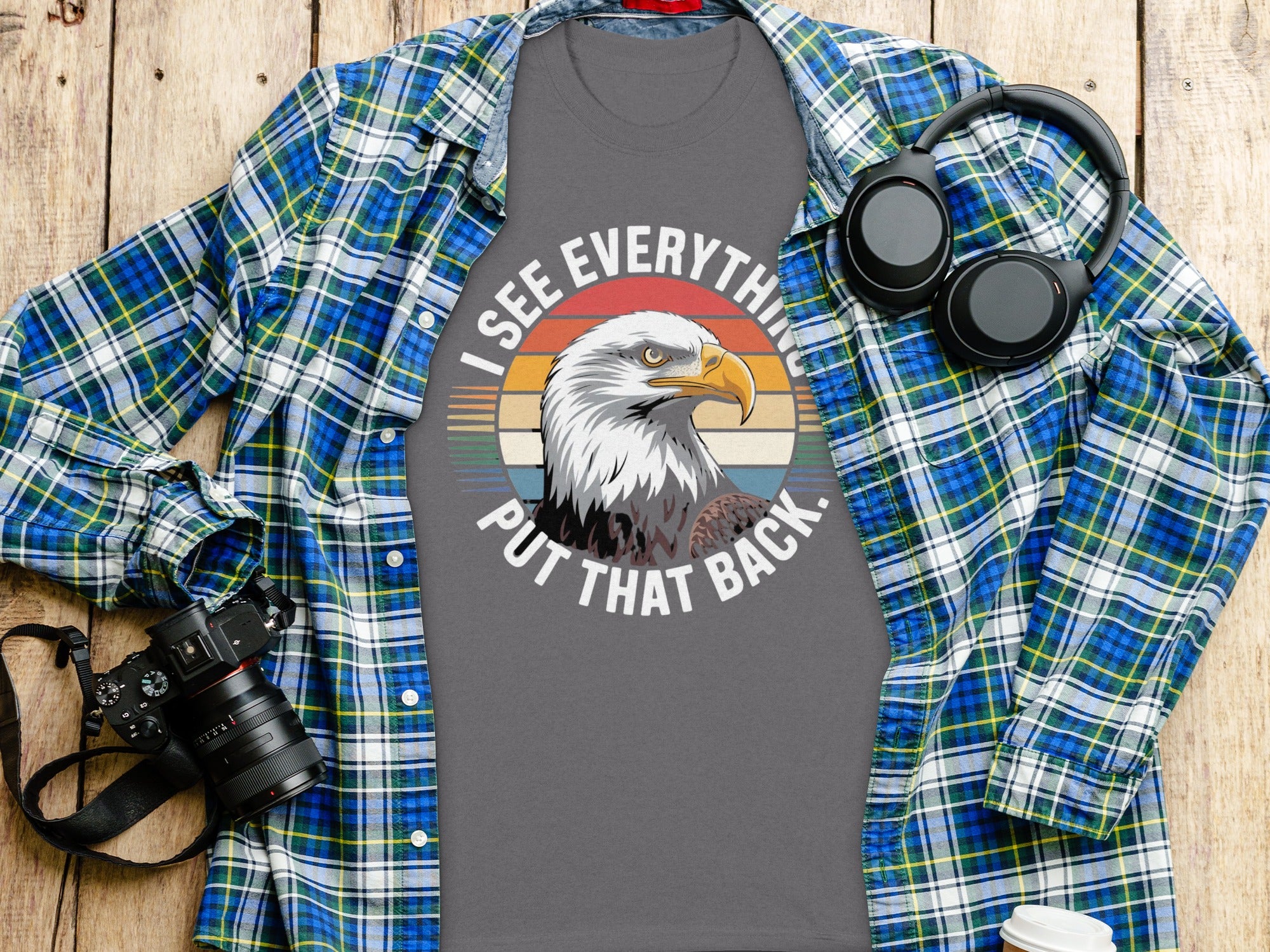 T-shirt with eagle graphic and text "I SEE EVERYTHING PUT THAT BACK."