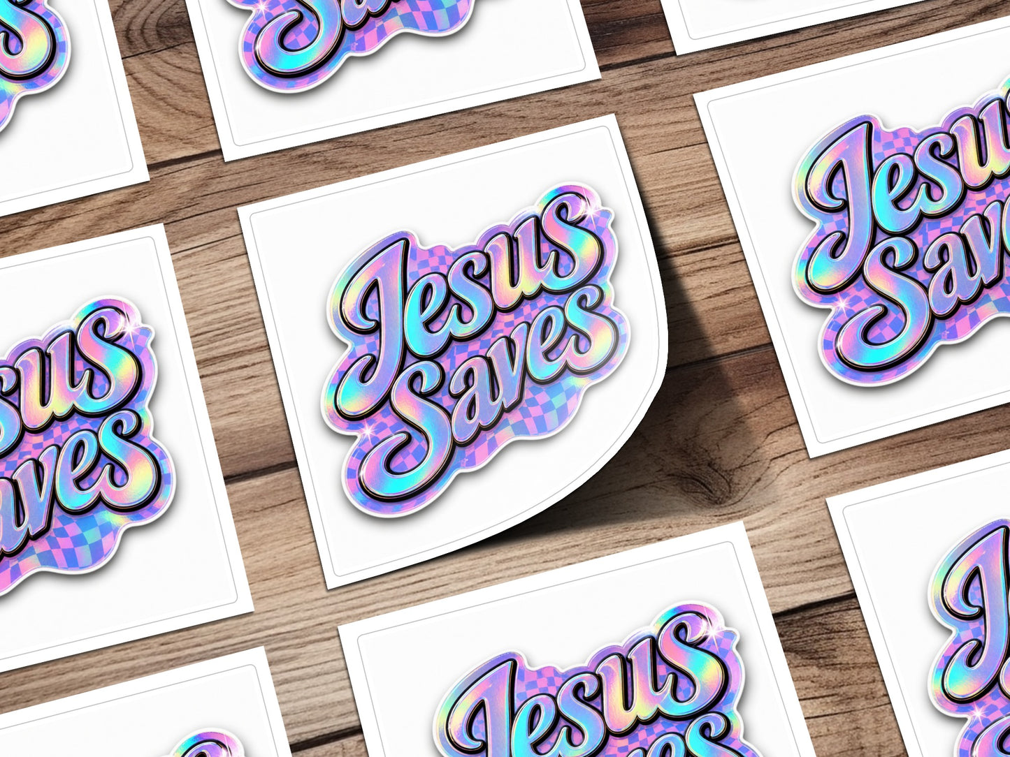 Holographic sticker with iridescent "Jesus Saves" text on a checkerboard background.