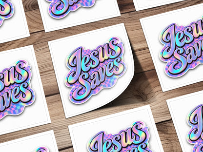 Holographic sticker with iridescent "Jesus Saves" text on a checkerboard background.