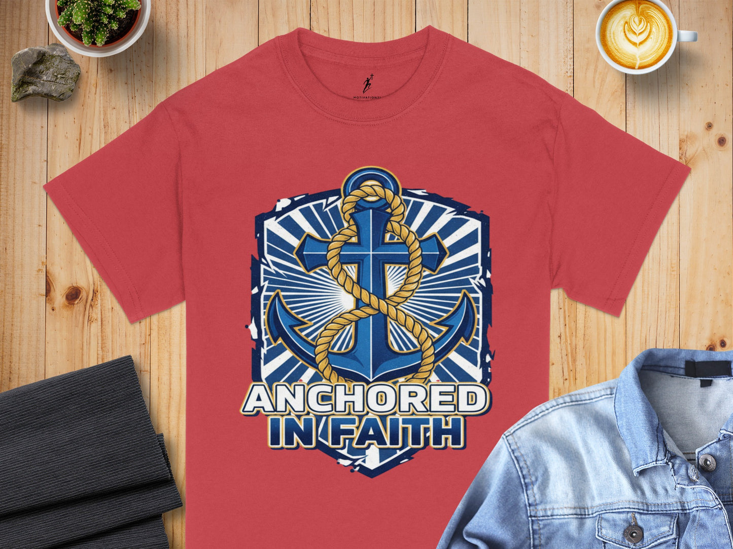 Salmon t-shirt with blue anchor graphic and text "ANCHORED IN FAITH".
