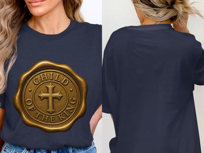 Navy t-shirt with gold circular seal featuring cross and text "Child of the King".