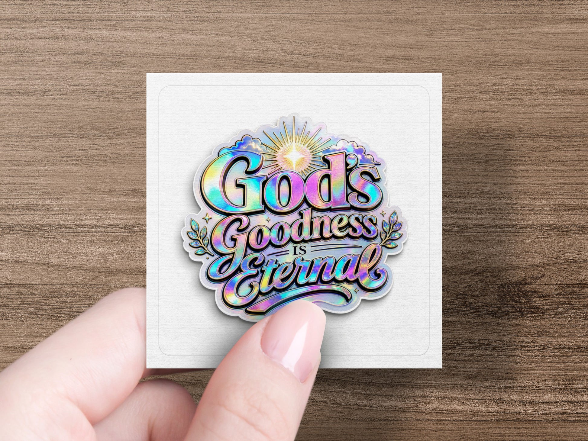 Holographic sticker with "God's Goodness is Eternal" text in colorful, stylized lettering.