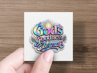 Holographic sticker with "God's Goodness is Eternal" text in colorful, stylized lettering.