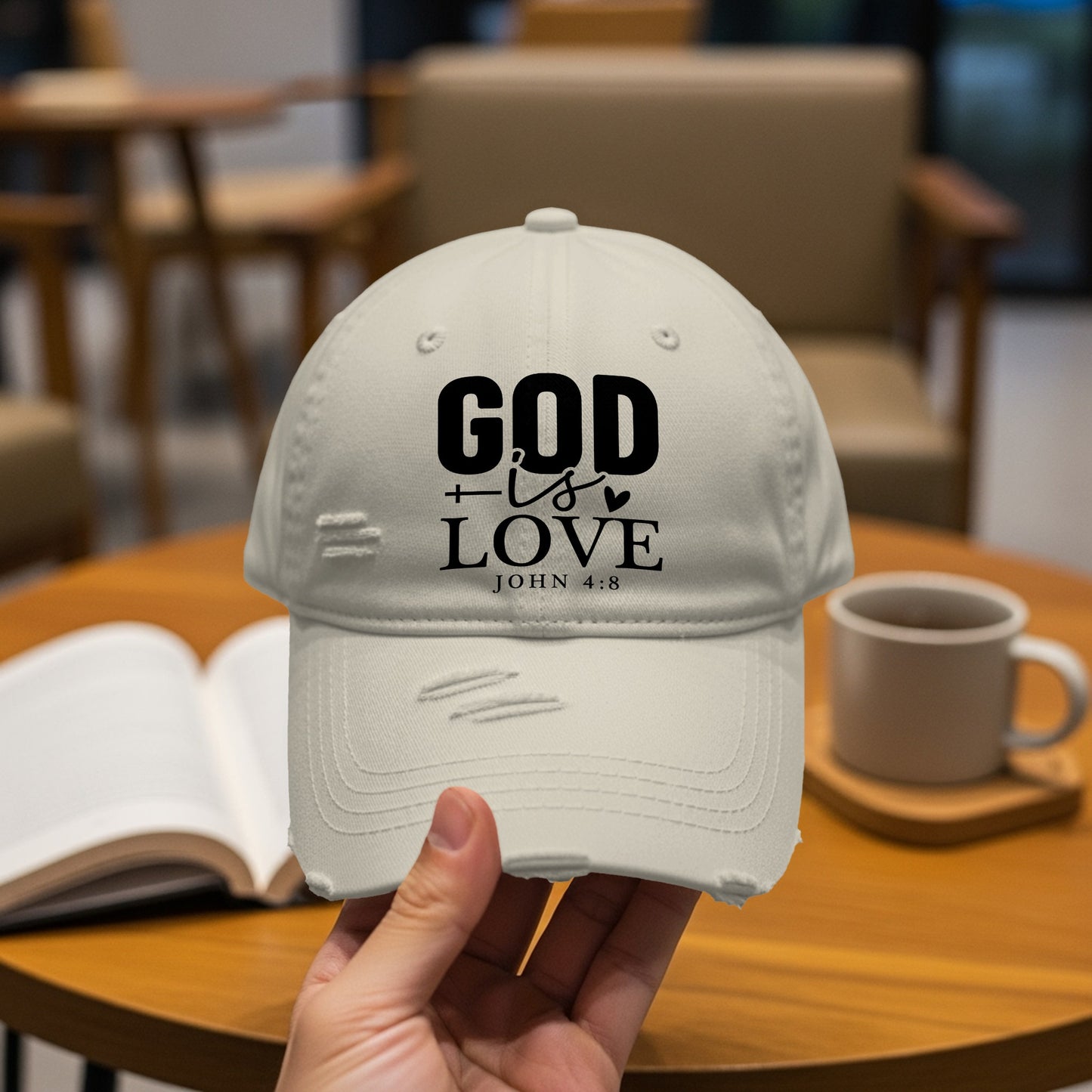 Cream distressed baseball cap with "GOD is LOVE JOHN 4:8" text.
