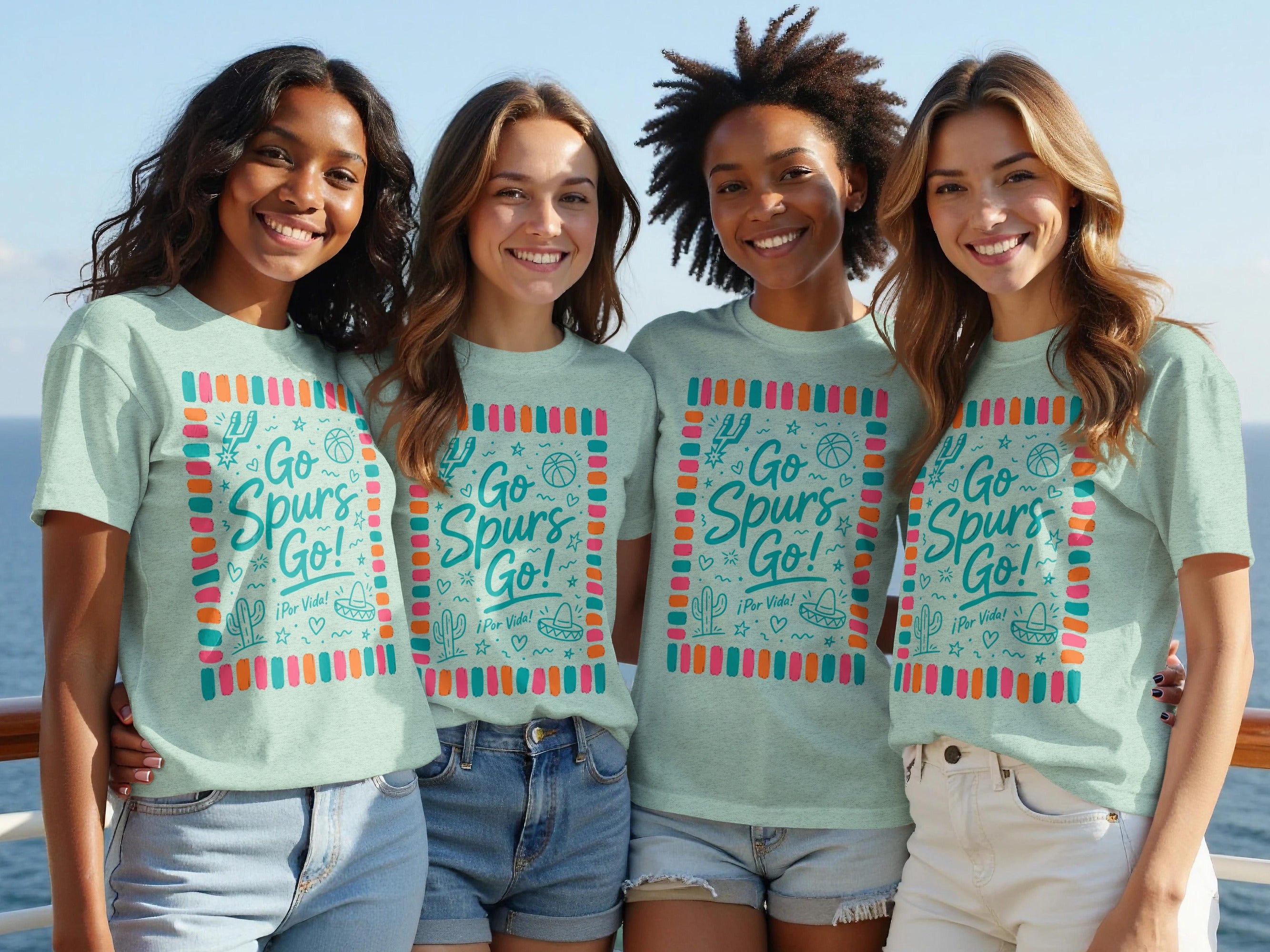 Four women wear matching teal t-shirts with "Go Spurs Go!" text.