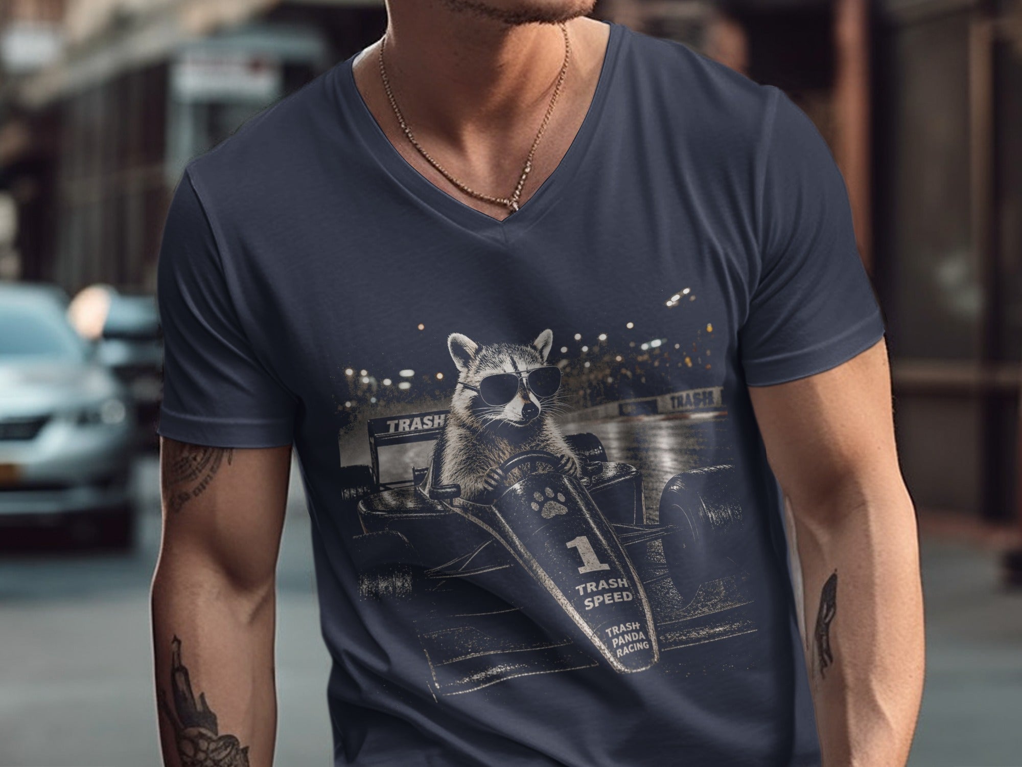 T-shirt graphic of raccoon in racing suit driving a formula car with "TRASH SPEED".