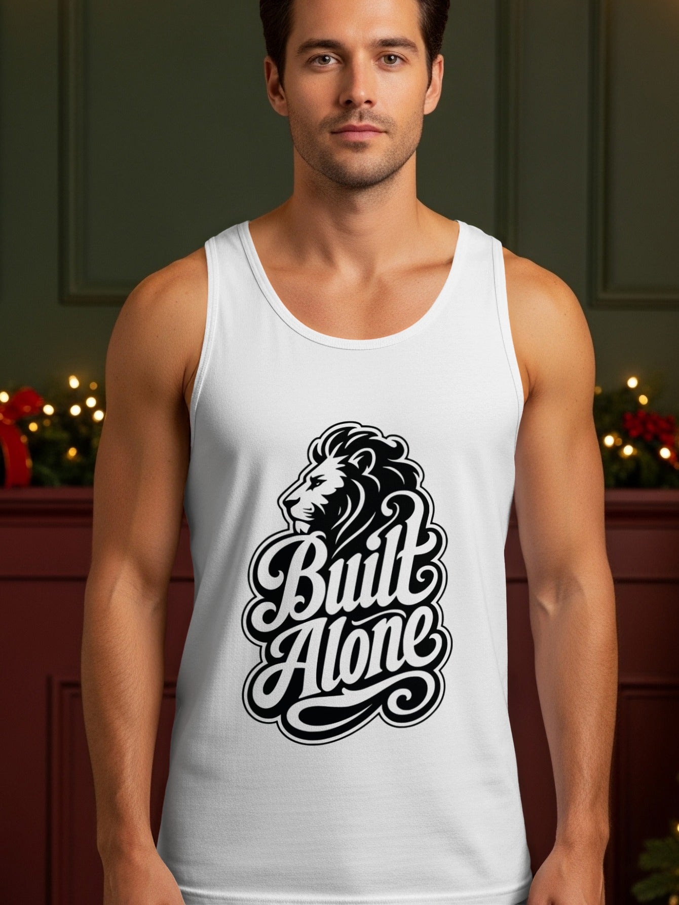 White tank top featuring a black lion head and "Built Alone" text design.
