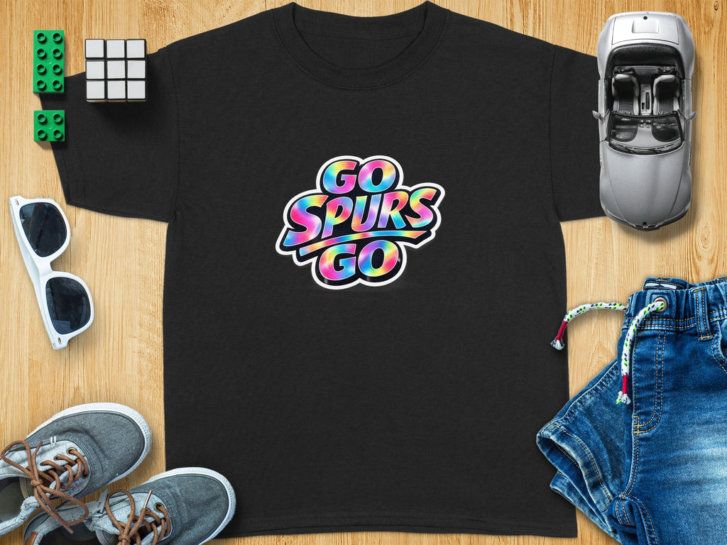 Black t-shirt with "Go Spurs Go" graphic, surrounded by toys and clothing.