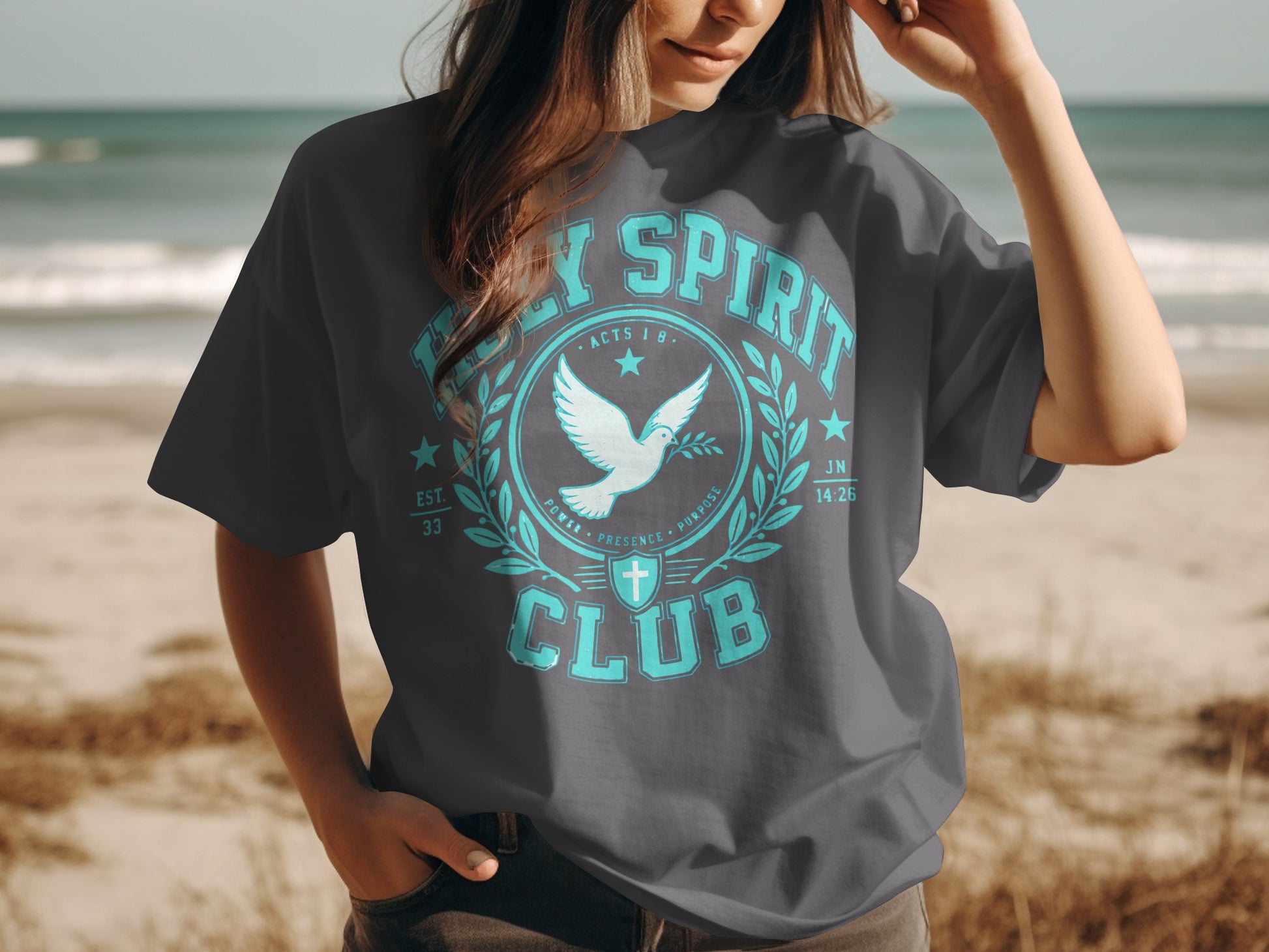 Dark grey t-shirt with "Holy Spirit Club" text, dove, and cross graphic.